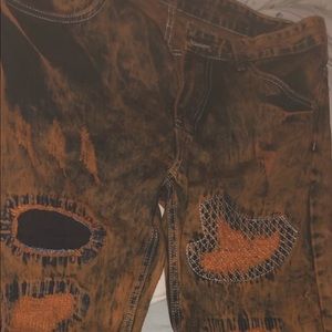 BLACK AND ORANGE BIKER JEANS WAIST 34-35